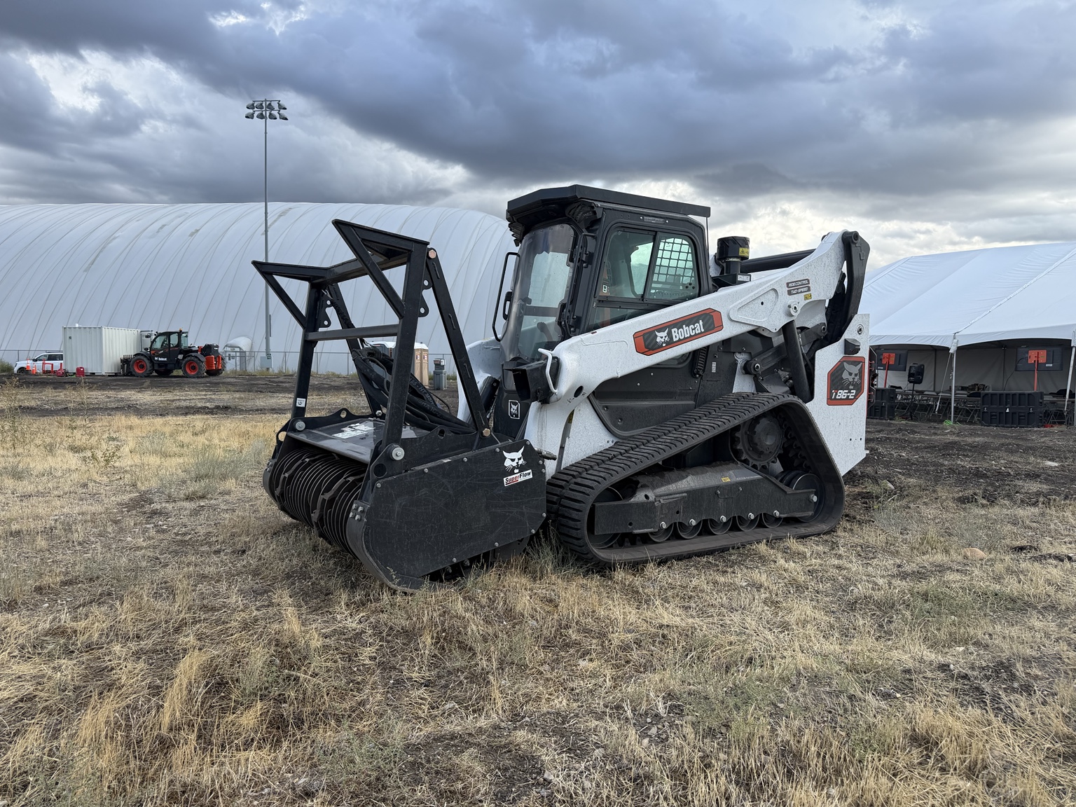 Bobcat T86-2 compact track loader displayed at regional training with a drum mulcher.