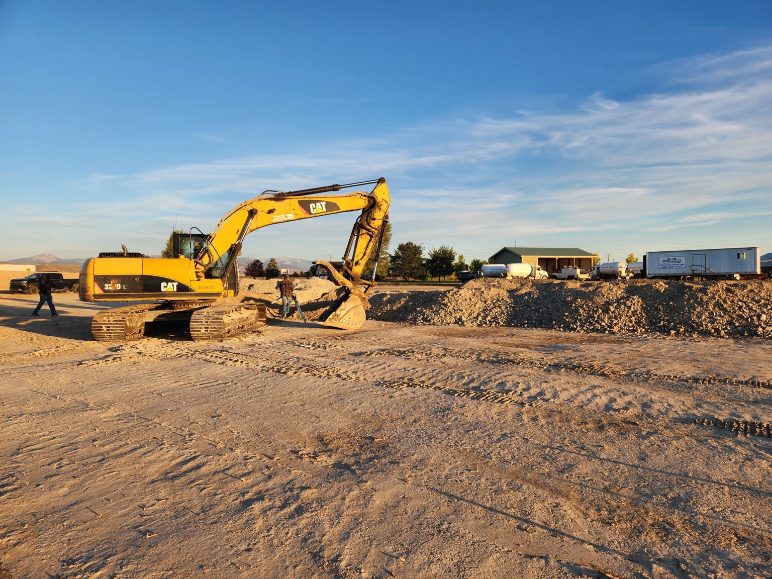 An excavator at work on the new Shepherd's Garage facility in Dillon, Montana